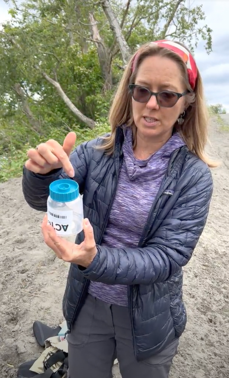 RE Sources' pollution prevention specialist Kirsten McDade samples water from the lower Nooksack River